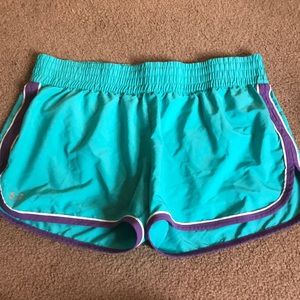 under armour turquoise and purple running shorts